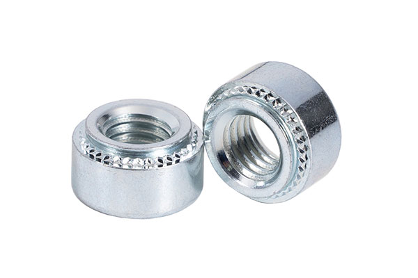 Two galvanized silver self clinching nuts